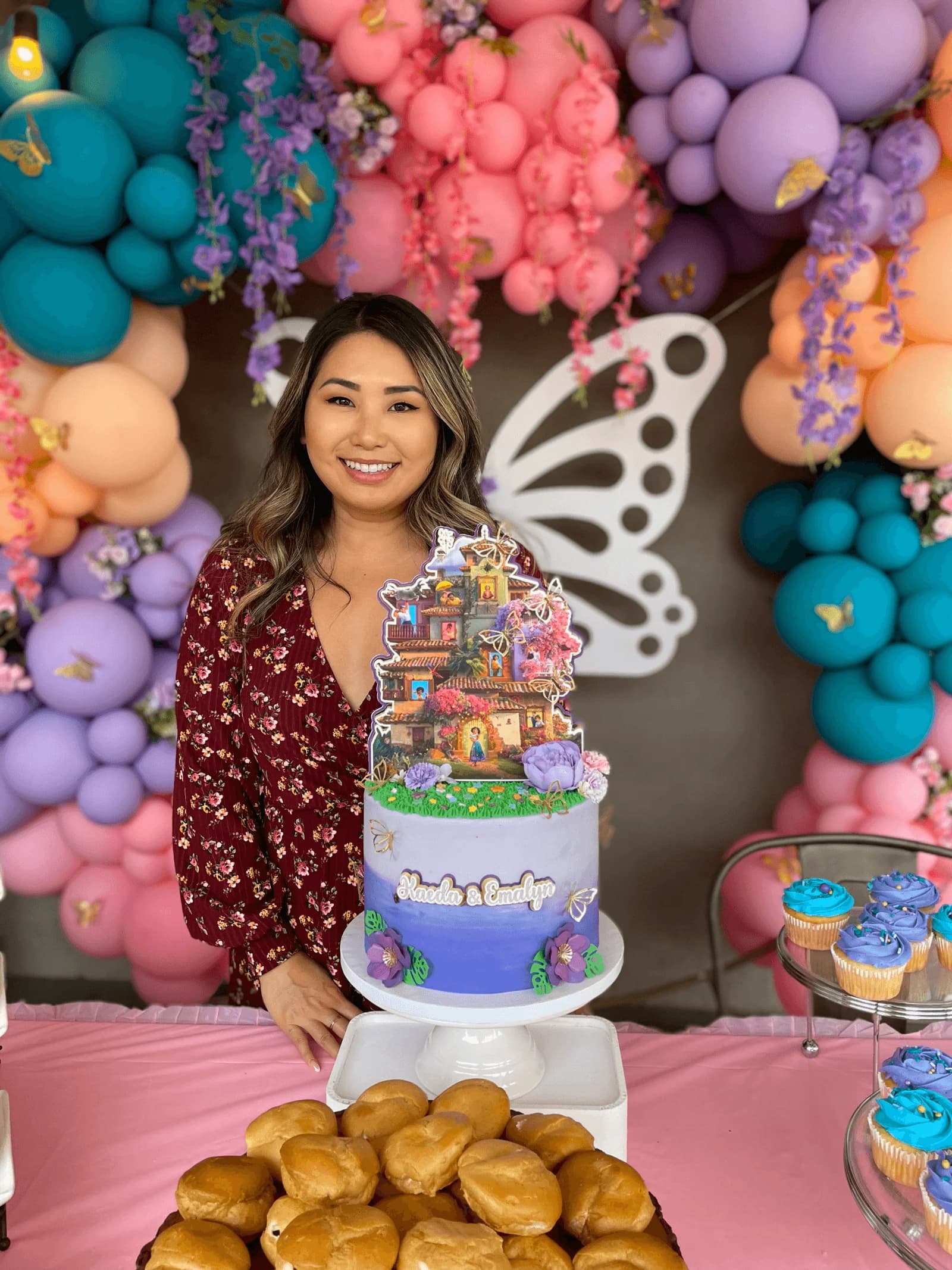 J from Sweets by J with a custom Encanto cake