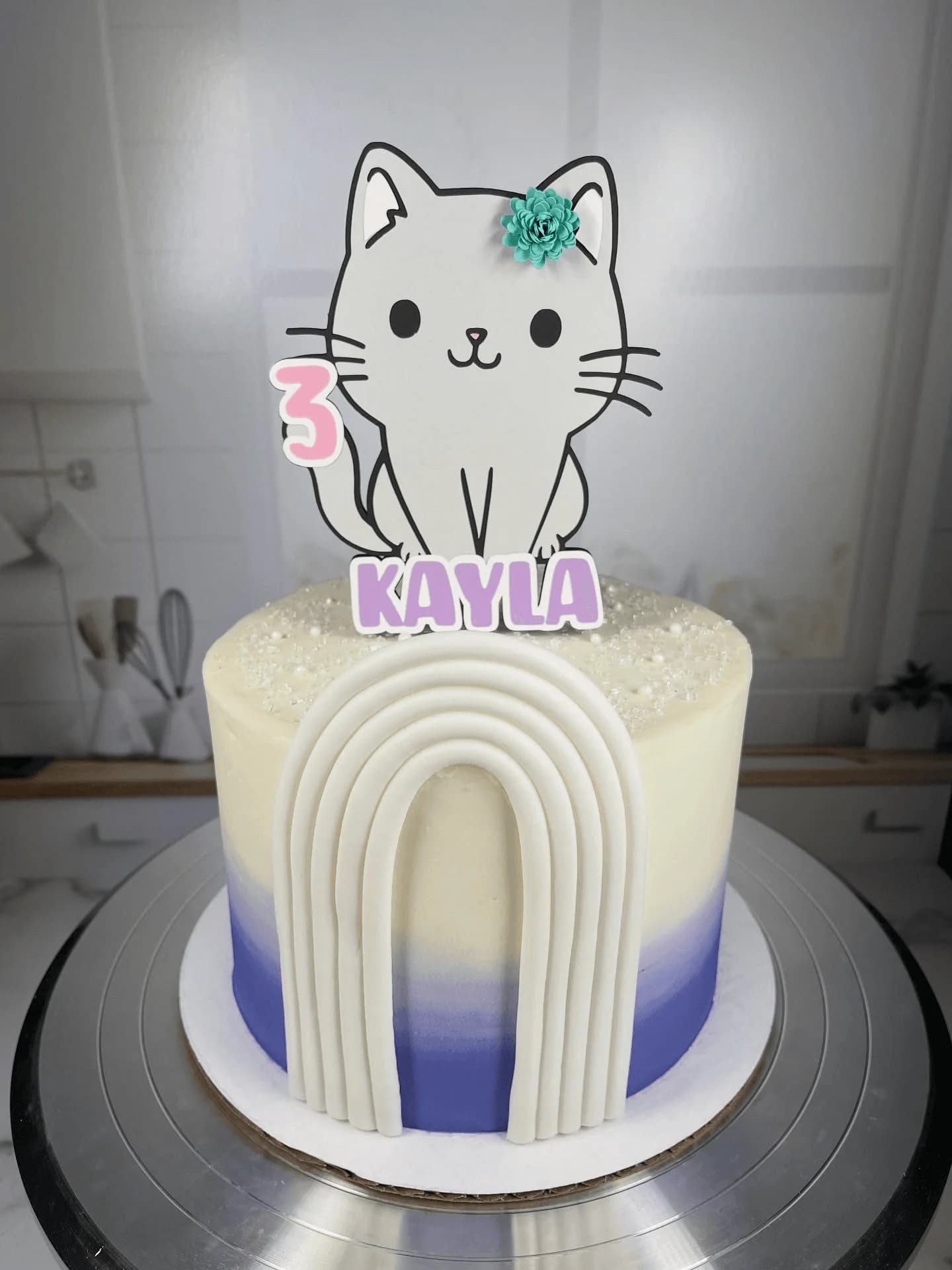 Cute cat themed birthday cake with rainbow gradient