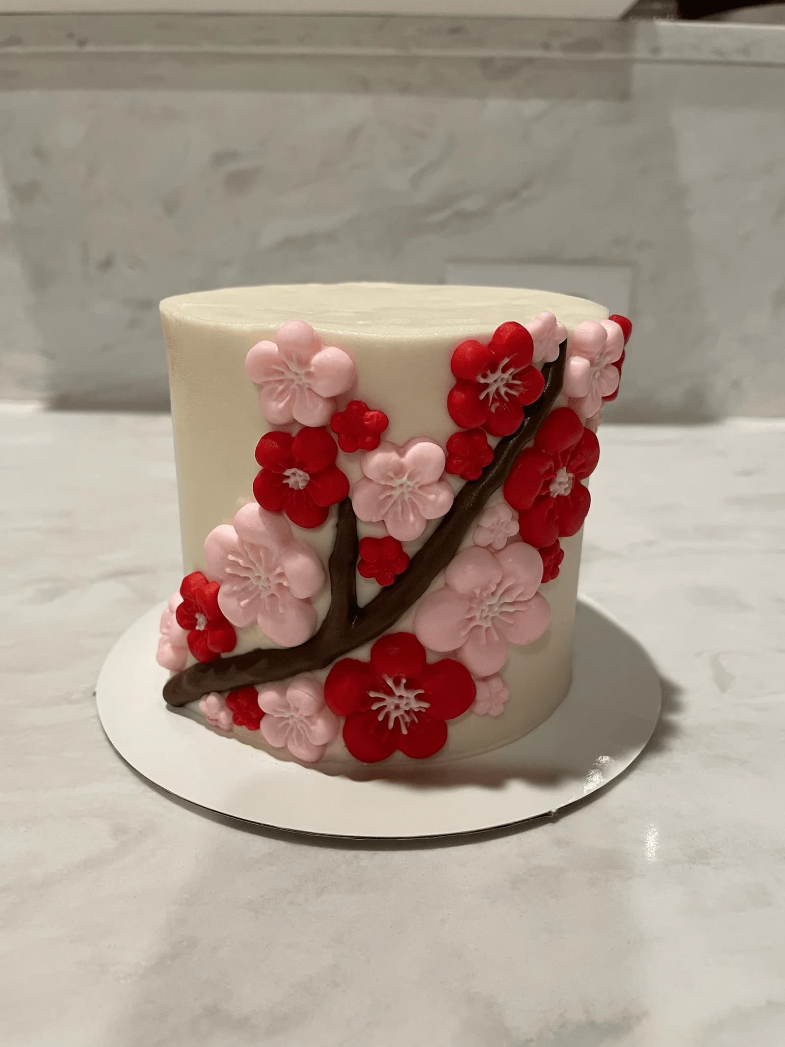 Red and white cherry blossom cake for Lunar New Year