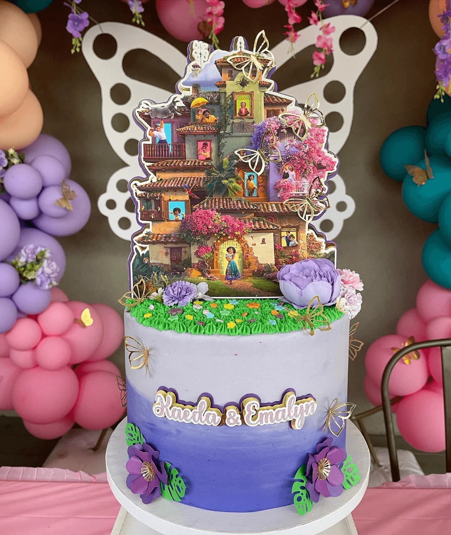 Disney Encanto themed cake with Mirabel and Casita decorations
