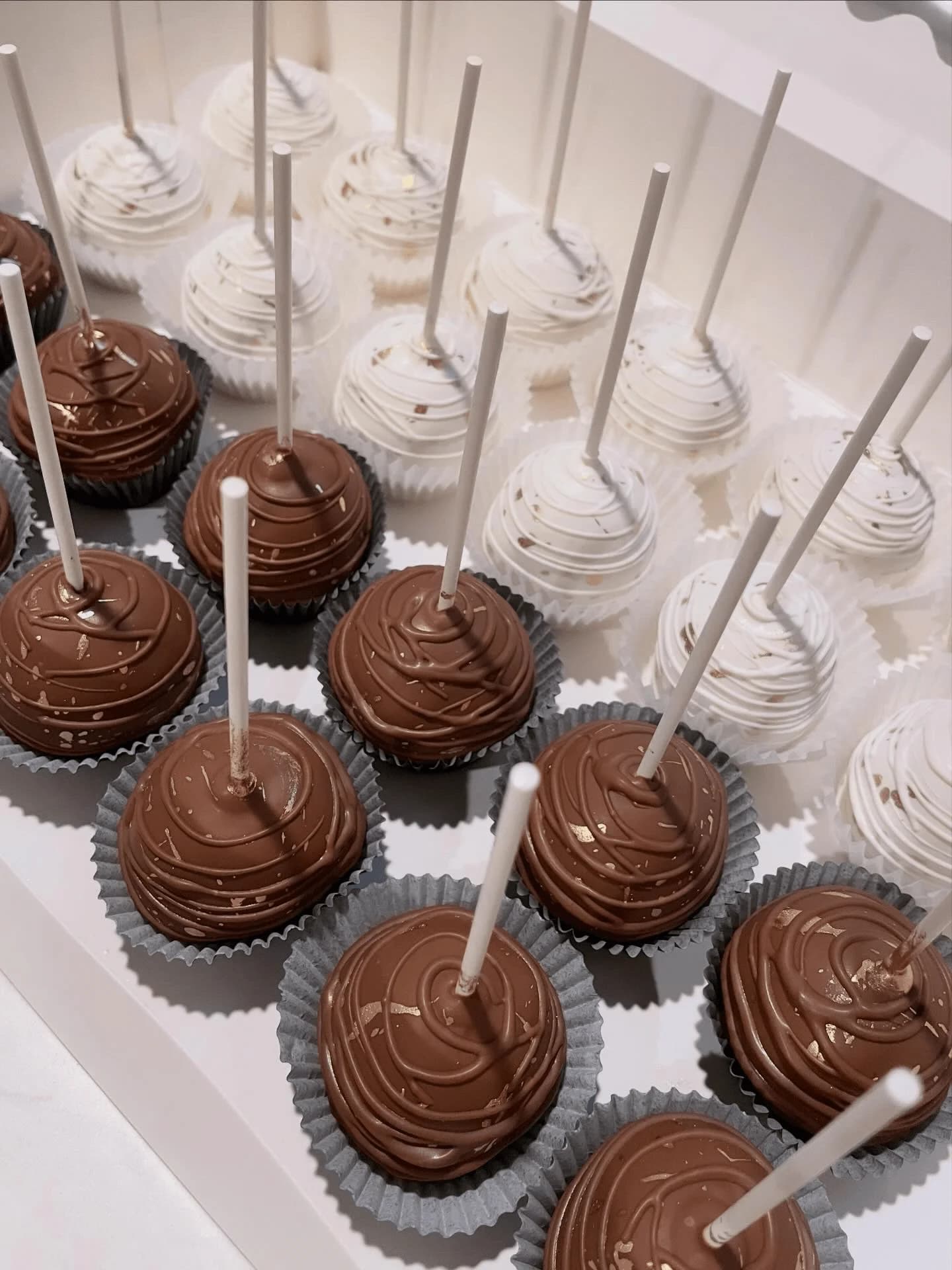 Decorated chocolate cake pops on sticks